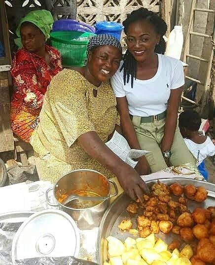 Nigerian Youth Corper Poses With Mum Who Sells Beancakes To Sponsor Her Education