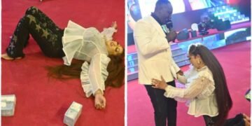 Prophet Jeremiah Omoto Fufeyin Splashes Bundles Of Naira Notes On His Wife
