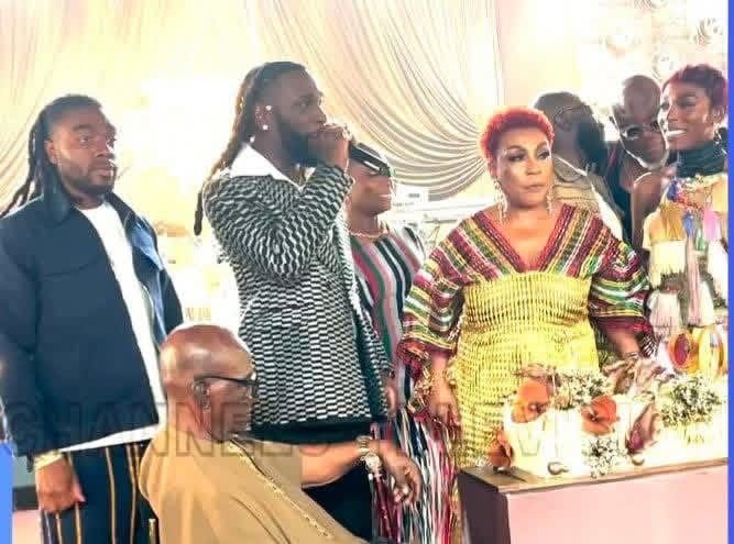 Burna Boy Pays Emotional Tribute To Grandfather Benson Idonije At 90th Birthday Celebration